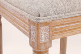Close-up of a carved rosette corner block, the reeded seat rail, a turned front leg and the Beige seat edge