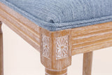 Close-up of a carved rosette corner block, the reeded seat rail, a turned front leg and the Denim Blue seat edge