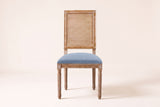 Castelfranco dining chair in Denim Blue, straight front view showing the cane-look back