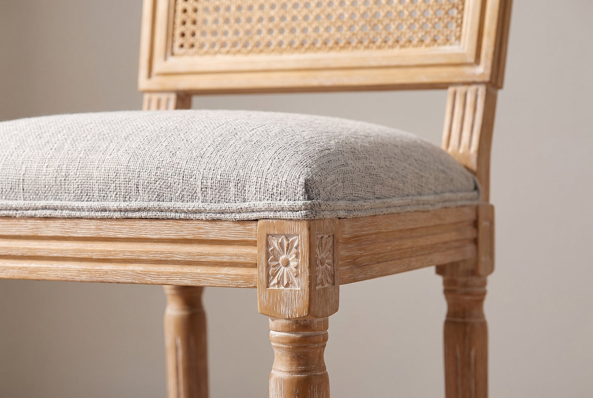 Close-up of the Light Grey linen-look seat, the reeded rail and the carved rosette on a front corner block