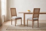 A pair of Castelfranco dining chairs in a bright Vancouver dining nook with a pale oak table and a bowl of lemons