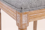 Close-up of a carved rosette corner block, the reeded seat rail, a turned front leg and the Mid Grey seat edge