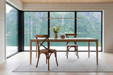 Two Castelmola dining chairs in Brown at a white-oak table in a Balestrand fjord house