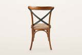The back of the Castelmola dining chair in Brown on a warm white studio backdrop