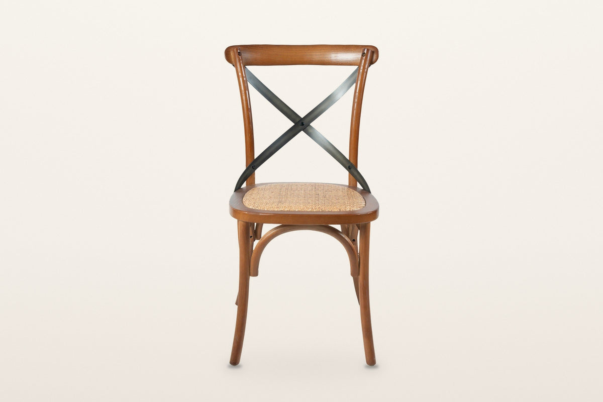 Castelmola dining chair in Brown, front view on a warm white studio backdrop