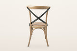 The back of the Castelmola dining chair in Natural Rustic on a warm white studio backdrop