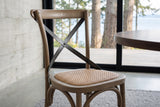 Close-up of the Castelmola seat and cross back in Sundried at seat height: the woven rattan seat in its wooden rim