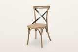 Castelmola cross back dining chair in Sundried, three-quarter view on a warm white studio backdrop: bentwood elm frame