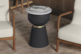 Celeste marble and black iron side table with magazines between two cream lounge chairs