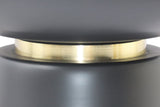 Close-up of the Celeste brushed gold band between the black iron bowl and base