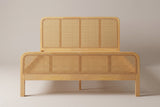Certaldo cane bed, straight front view: the lower cane-style footboard in front of the taller headboard