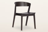 Certosa dining chair in mocha, three-quarter view on a warm white studio backdrop