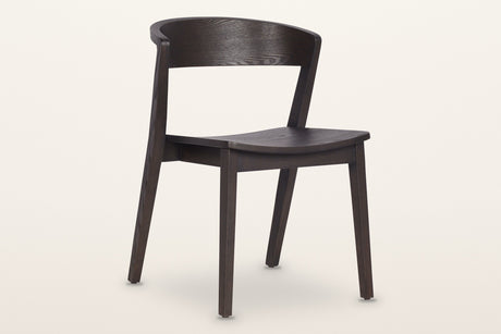 Certosa dining chair in mocha, three-quarter view on a warm white studio backdrop