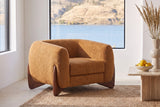 Cervia lounge chair on a jute rug in a Kelowna lake house with a window onto the lake and hills (Caramel)