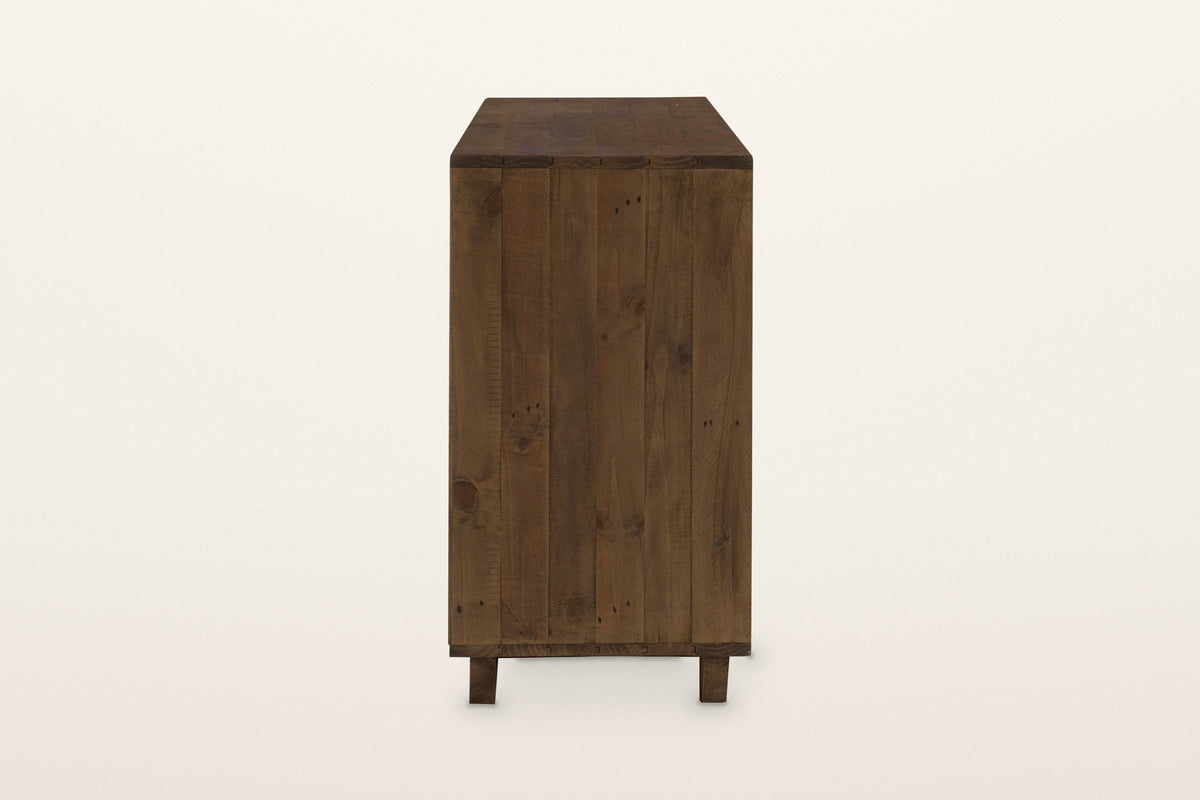 The right end of the Cervinia dresser: an end panel of vertical reclaimed pine planks on two block feet
