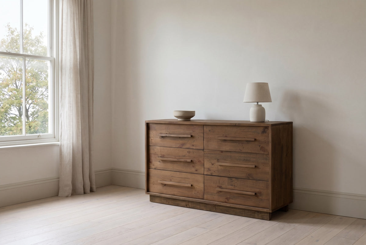 Cervinia reclaimed pine dresser against a warm white plaster wall in a Halifax, Nova Scotia bedroom, a maple tree through the sash window