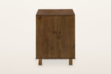 The right side of the Cervinia nightstand: six vertical reclaimed pine planks over two plinth blocks