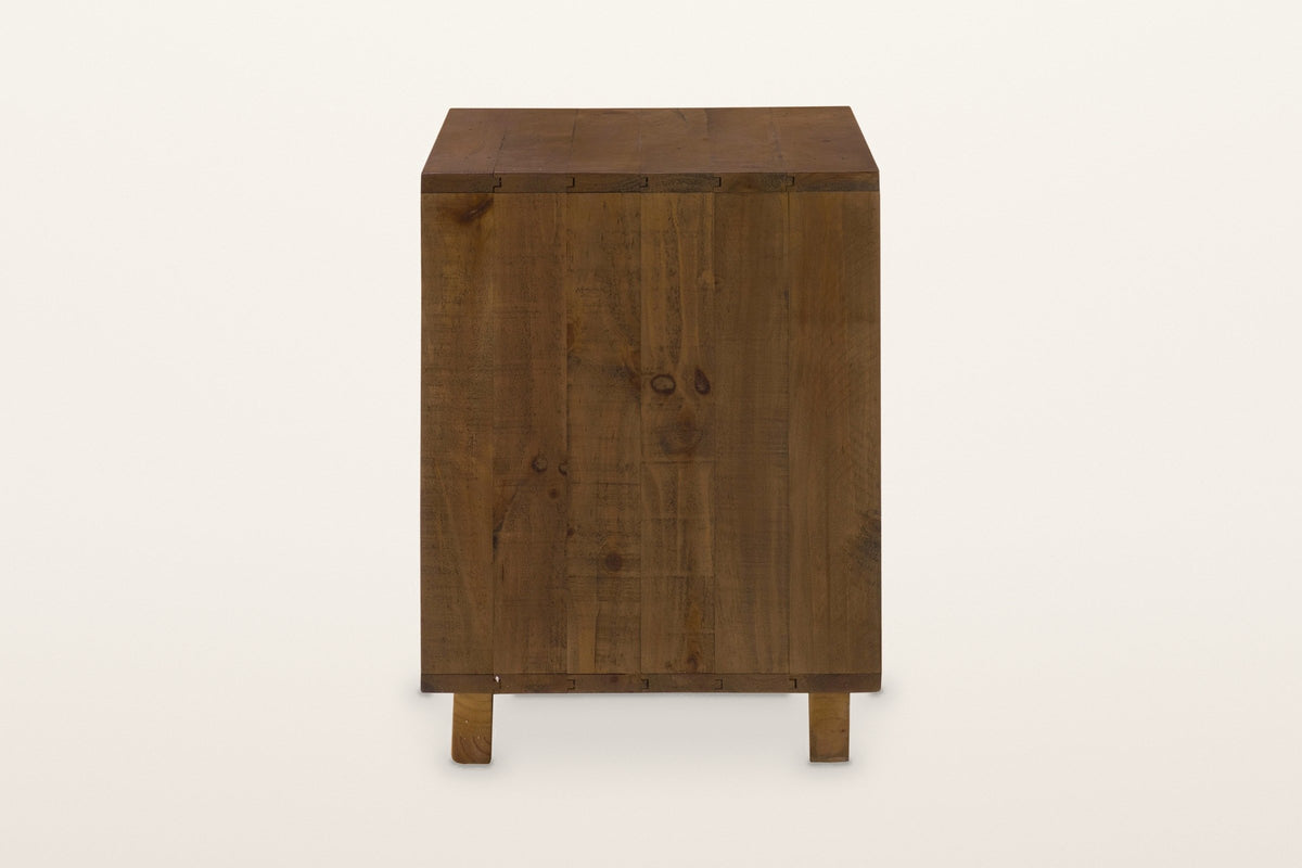 The right side of the Cervinia nightstand: six vertical reclaimed pine planks over two plinth blocks