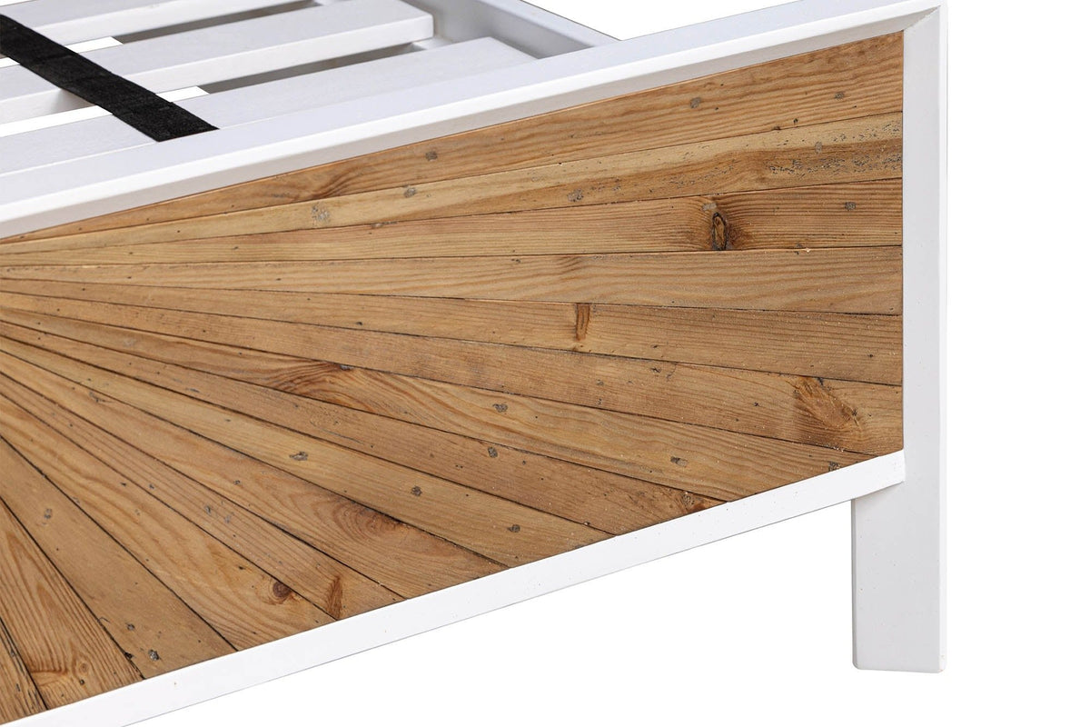 Close-up of a Cesana footboard corner: the pine rays inside the slim white lacquer frame above one square white leg