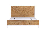 Cesana bed in King size seen from the foot end: the wider pine sunburst headboard and footboard in a white lacquer frame