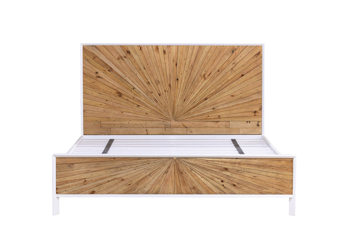 Cesana bed in King size seen from the foot end: the wider pine sunburst headboard and footboard in a white lacquer frame