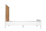 The Cesana bed from the side: the tall pine headboard, the plain white rail on square legs and the low footboard