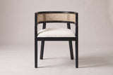 Cesena dining chair in Black, straight front view showing the barrel back, the cane-look band and four legs