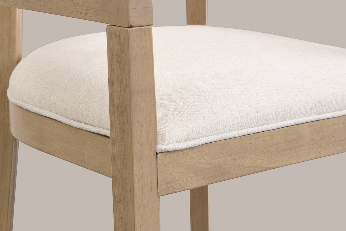 Close-up of the welted linen-look seat, the wood seat frame and a tapered front leg of the Natural Ash Cesena chair