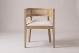 Cesena dining chair in Natural Ash, straight front view showing the barrel back, the cane-look band and four legs
