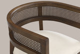 Close-up of the wide curved top rail, the cane-look weave band and the arm of the Walnut Cesena chair