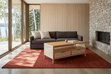Cetara coffee table in Natural ash and wicker seen from above at the corner in a lake house at Clear Lake, Manitoba