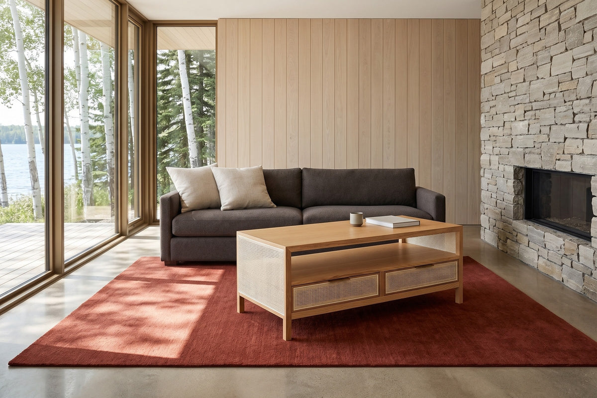 Cetara coffee table in Natural ash and wicker seen from above at the corner in a lake house at Clear Lake, Manitoba
