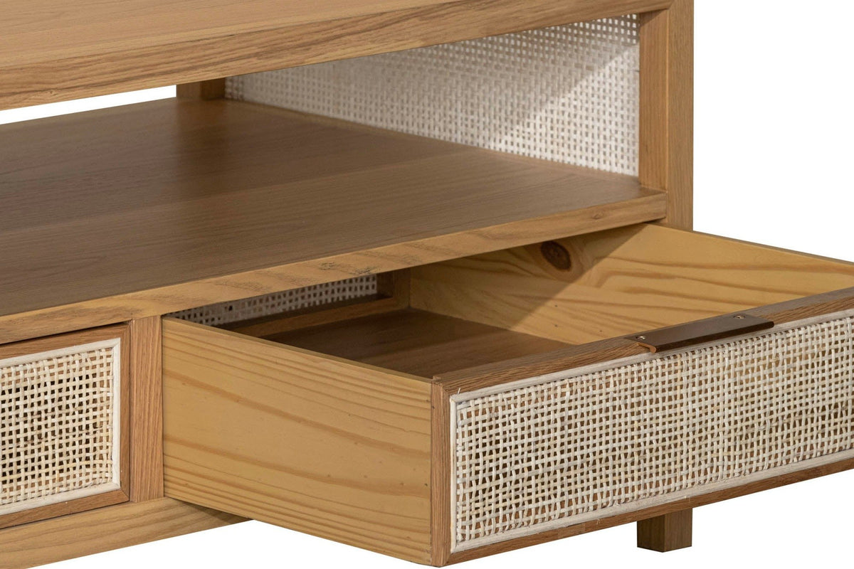 Close-up of a Cetara drawer pulled out: the wicker front with its slim brass pull