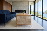 End view of the Cetara coffee table in Natural ash and wicker in a St. John's house above the Narrows