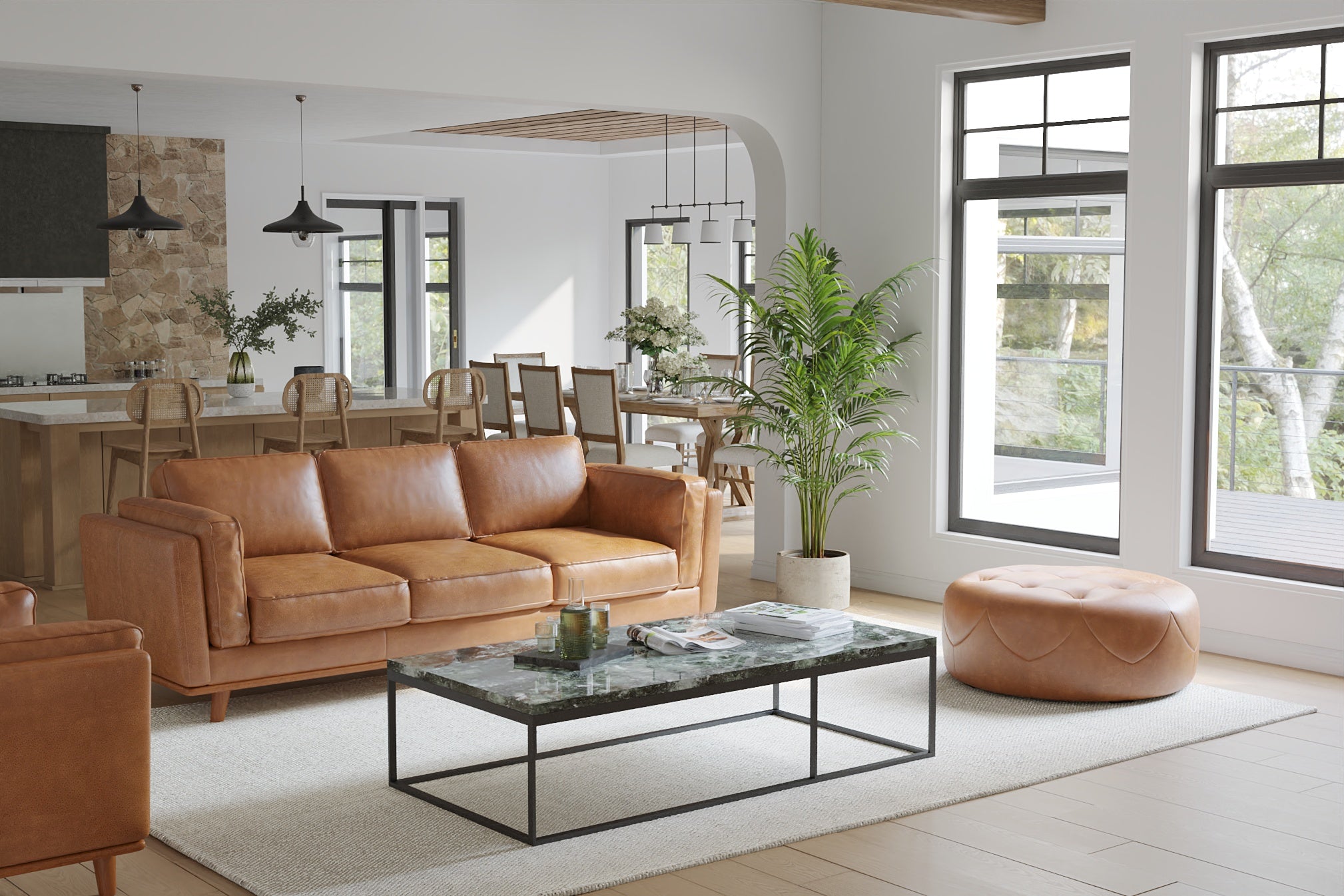 In a Living Room, There is Sitting A Luxurious, Royal Cognac, Kiln Dried Wood Frame, Artisan Round Full Leather Ottoman with a Set of Three Sofa.