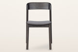 Chiavenna dining chair in mocha, straight front view: the curved back rail, the thin seat and four round legs