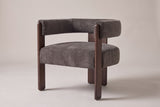 Chioggia velvet accent chair in Dark Brown, three-quarter view on a warm studio backdrop