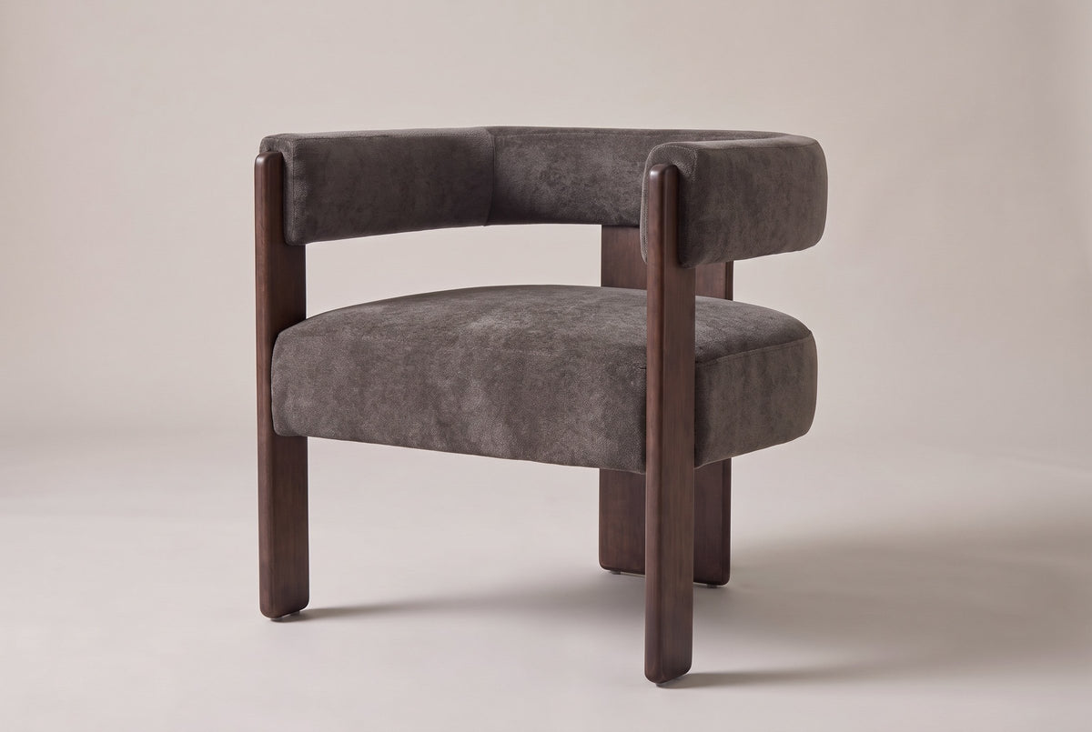 Chioggia velvet accent chair in Dark Brown, three-quarter view on a warm studio backdrop