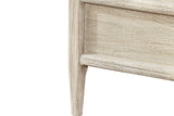 Close-up of a Chiusdino foot corner: the tapered leg and the rounded top and bottom mouldings of the rail