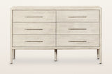 Chiusdino dresser, straight front view on a warm white studio backdrop: six equal drawers in two columns of three