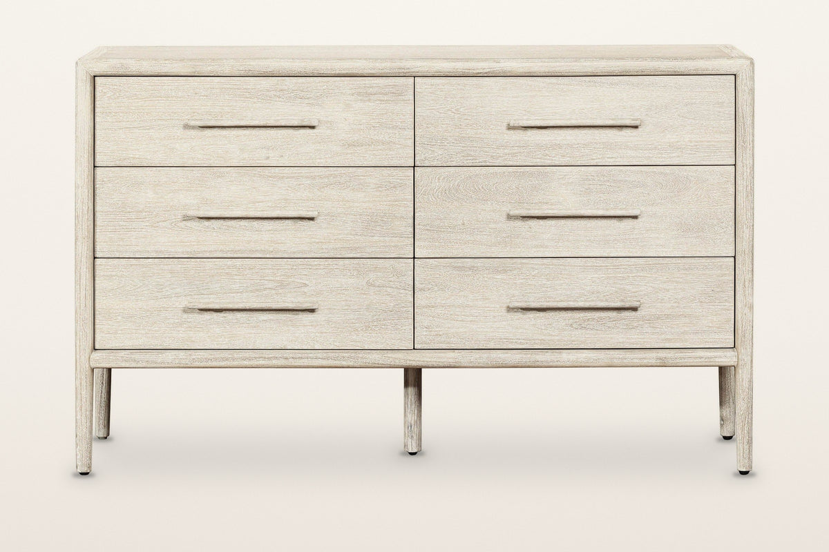 Chiusdino dresser, straight front view on a warm white studio backdrop: six equal drawers in two columns of three