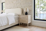 Chiusdino nightstand in whitewashed wood at a three-quarter angle in a Hecla Island bedroom, Manitoba