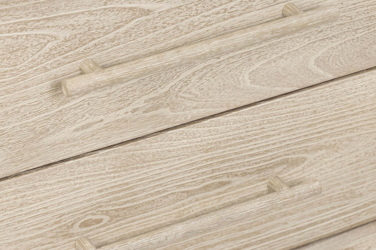 Close-up of the Chiusdino drawers: round wooden bar pulls, each on two short posts