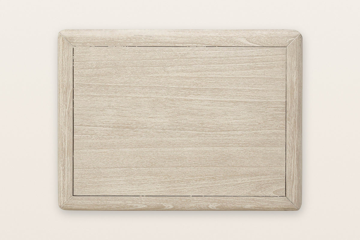Chiusdino nightstand seen from above on a warm white ground: a flat top inside a rounded frame with softly rounded corners