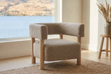 Cingoli chair in a bright Kelowna lake house sitting room with a lake view and a jute rug