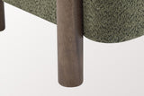 Close-up of a round walnut-stained rubberwood leg beside the rounded Olive Green boucle seat of the Cingoli chair