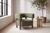 Cingoli boucle chair in a Montreal loft living room with a white brick wall
