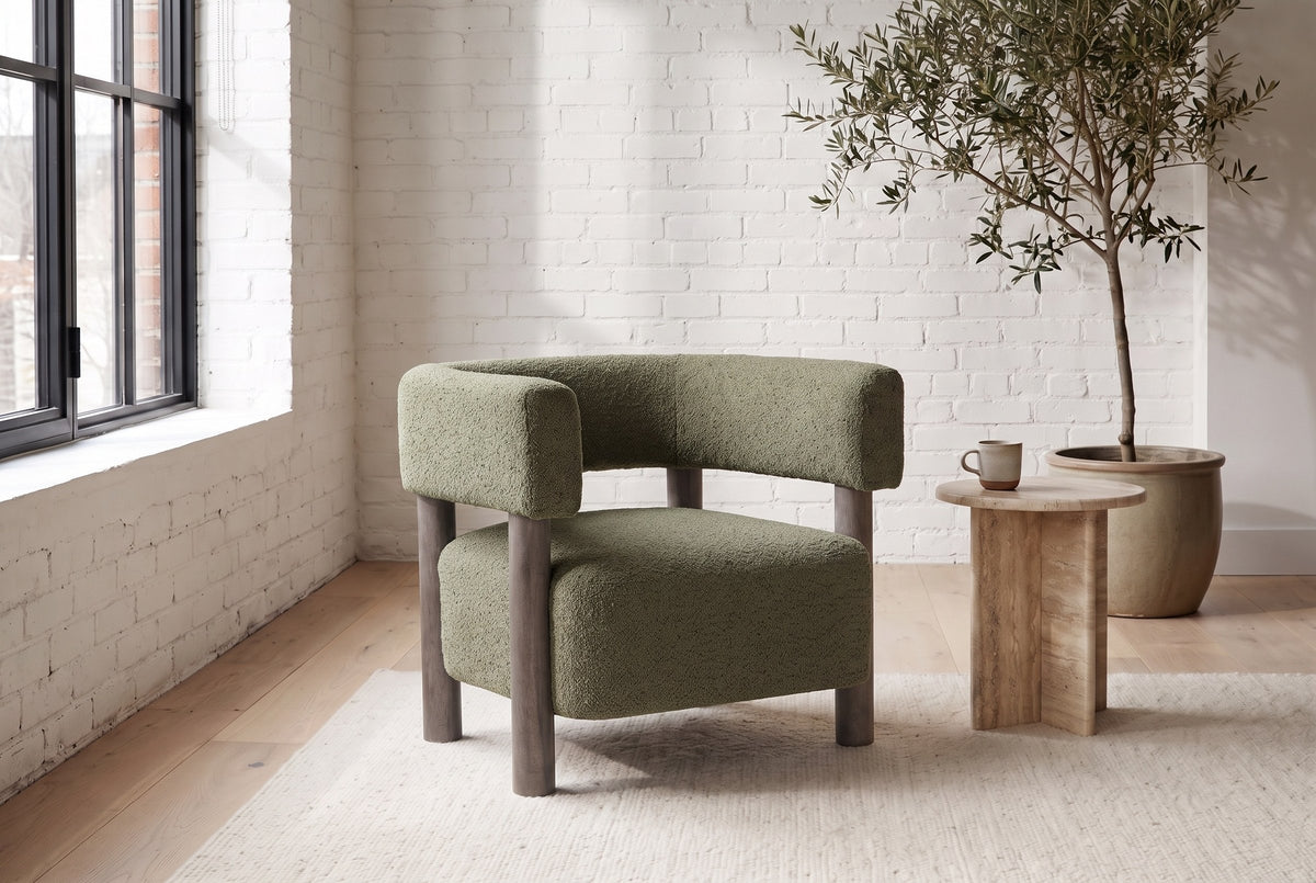 Cingoli boucle chair in a Montreal loft living room with a white brick wall