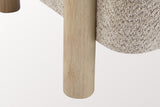 Close-up of a round natural rubberwood leg beside the rounded Wheat boucle seat of the Cingoli chair