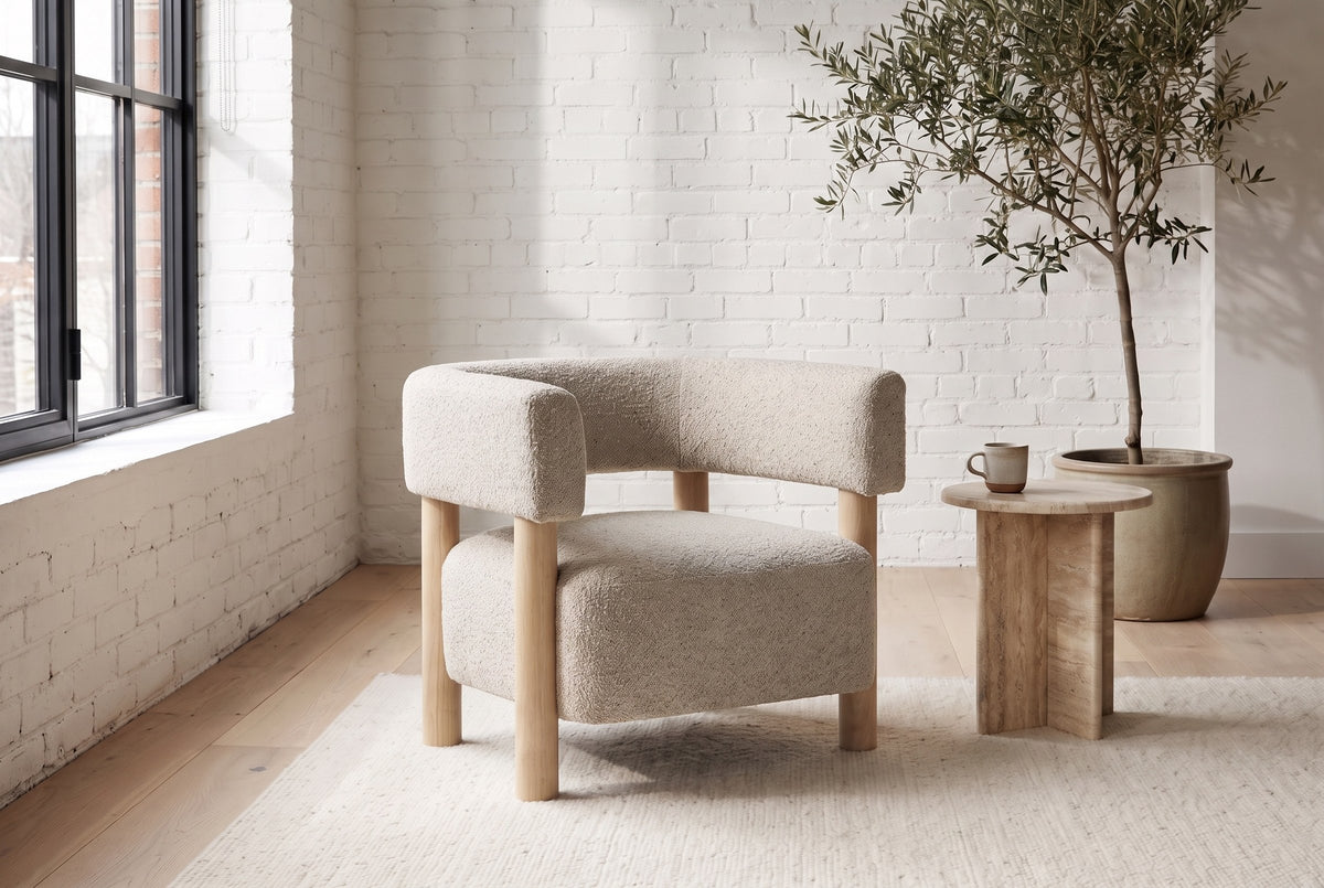 Cingoli boucle chair in a Montreal loft living room with a white brick wall